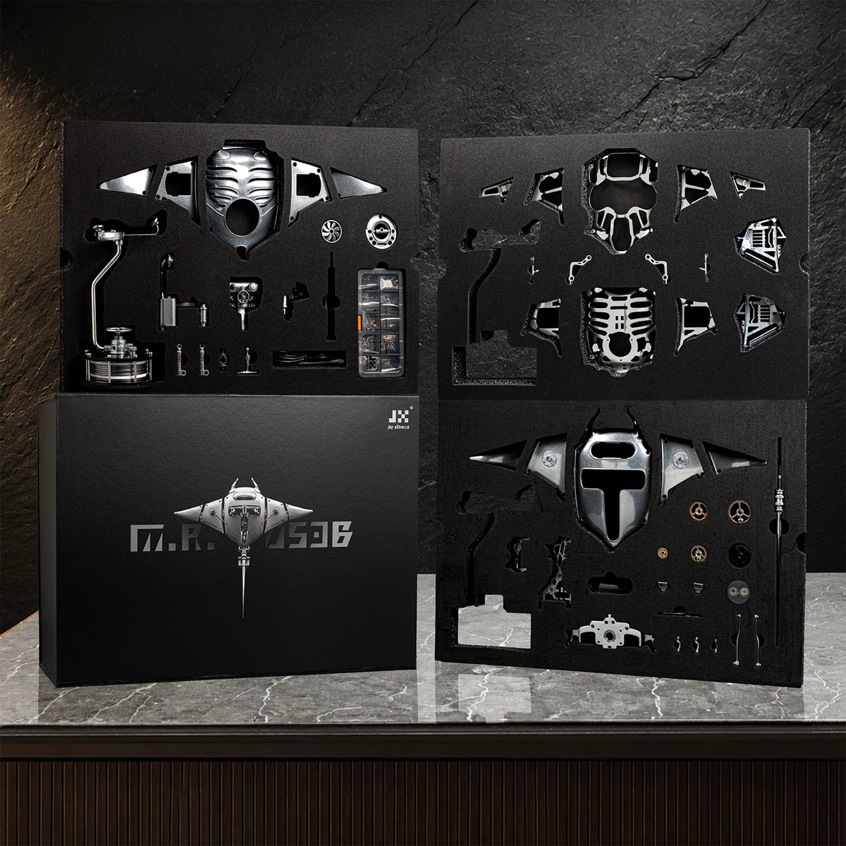 Mecha Ray Natural Metal — the assembly kit laid out as cut component sheets with tools and fixings, kinetic sculpture by IFL Watches.