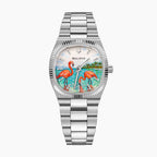 Bulova Super Seville Mini Havana — Hand-painted custom Super Seville Mini with two coral flamingos wading in turquoise water beneath a palm-lined shore and pale pearl sky, set in a 25mm stainless steel cushion case, a bespoke timepiece by IFL Watches.
