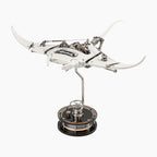 Mecha Ray White — motorised manta with wings swept wide and the gear train visible along its back, on a weighted drive base, kinetic metal sculpture by IFL Watches.