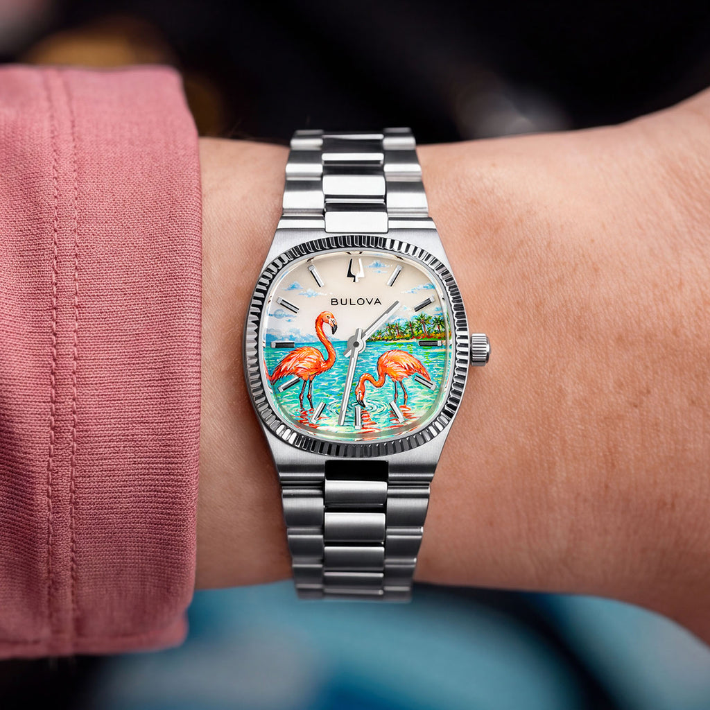 Bulova Super Seville Mini Havana — Bespoke 25mm steel watch worn on the wrist, its hand-painted flamingo scene spread across the mother-of-pearl dial, customized exclusively by IFL Watches.