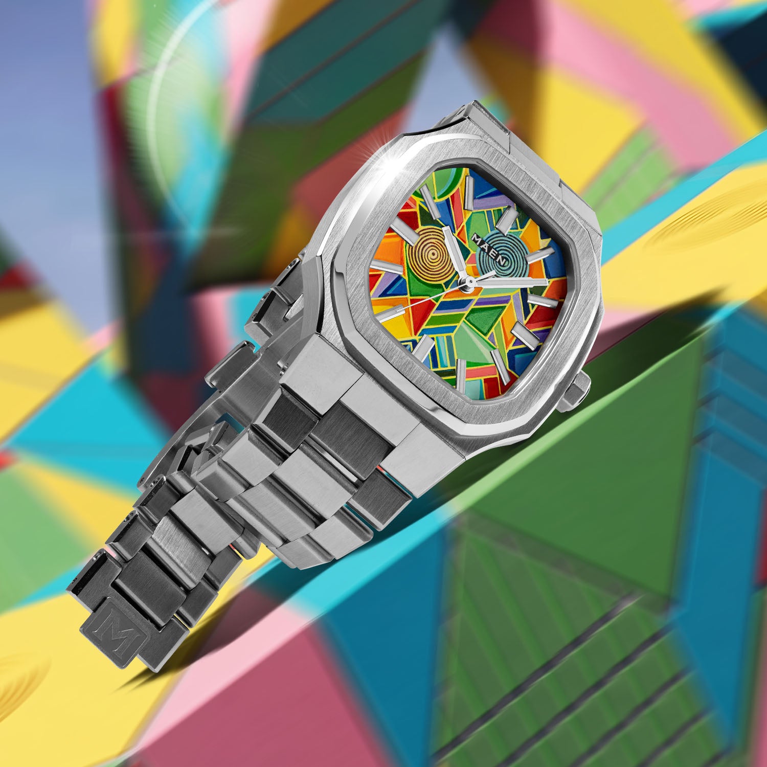 MAEN Manhattan Paradox — hand-painted geometric color-block dial with chevrons, mesh, and two concentric disks on a 37mm octagonal stainless steel case with integrated bracelet, limited edition timepiece by IFL Watches.
