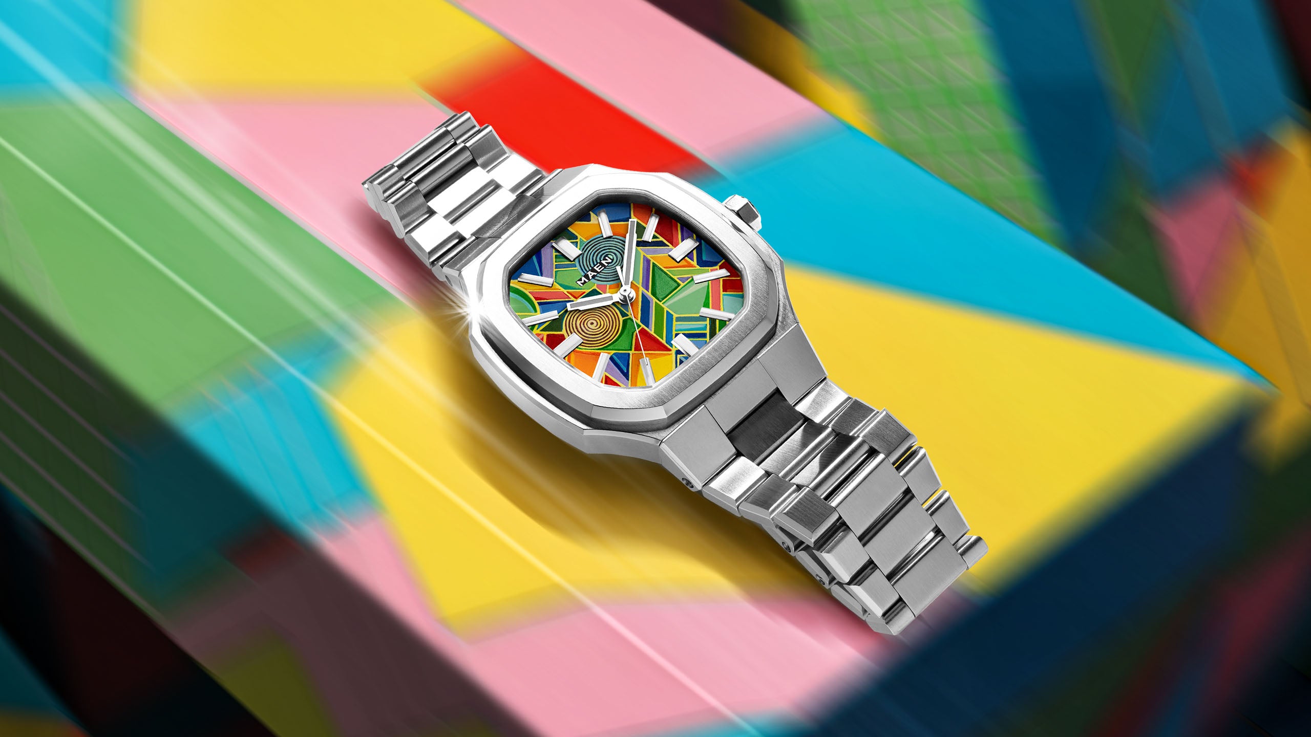 MAEN Manhattan Paradox — hand-painted color-block dial with chevrons, mesh, and two concentric disks on the 37mm MAEN Manhattan 37 cushion case, limited edition timepiece by IFL Watches. 