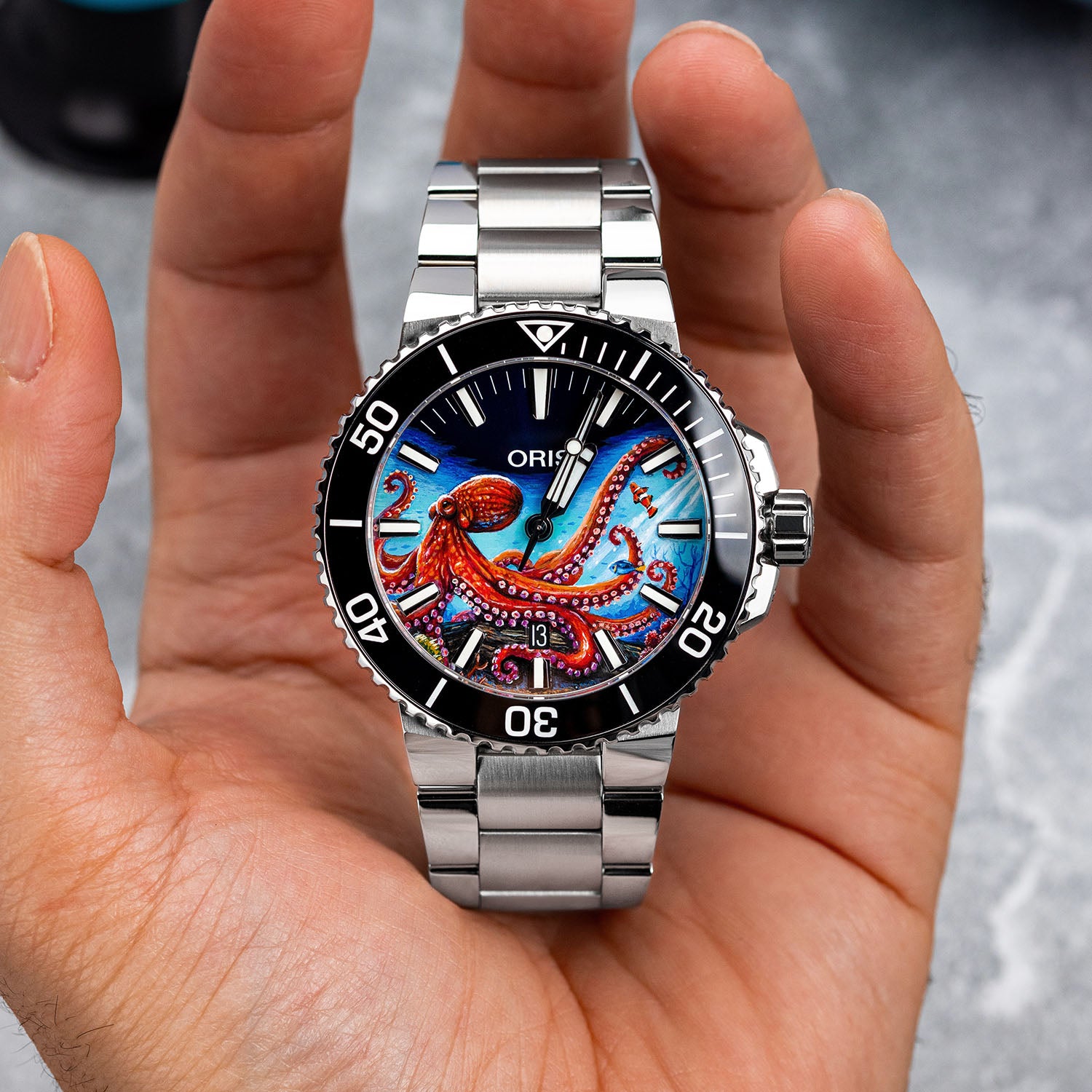 Aquis Octopus Concept – bespoke Oris Aquis dive watch with a hand-painted octopus motif, blue swirling currents, and marine-inspired elements, blending Swiss precision with oceanic beauty. Customized by IFL Watches.