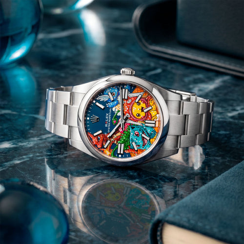Dream Team Concept: Evolution — Hand-painted bespoke timepiece featuring four colorful pop art figures rendered in glittering mosaic-tile style on a blue 41mm custom automatic dial by IFL Watches