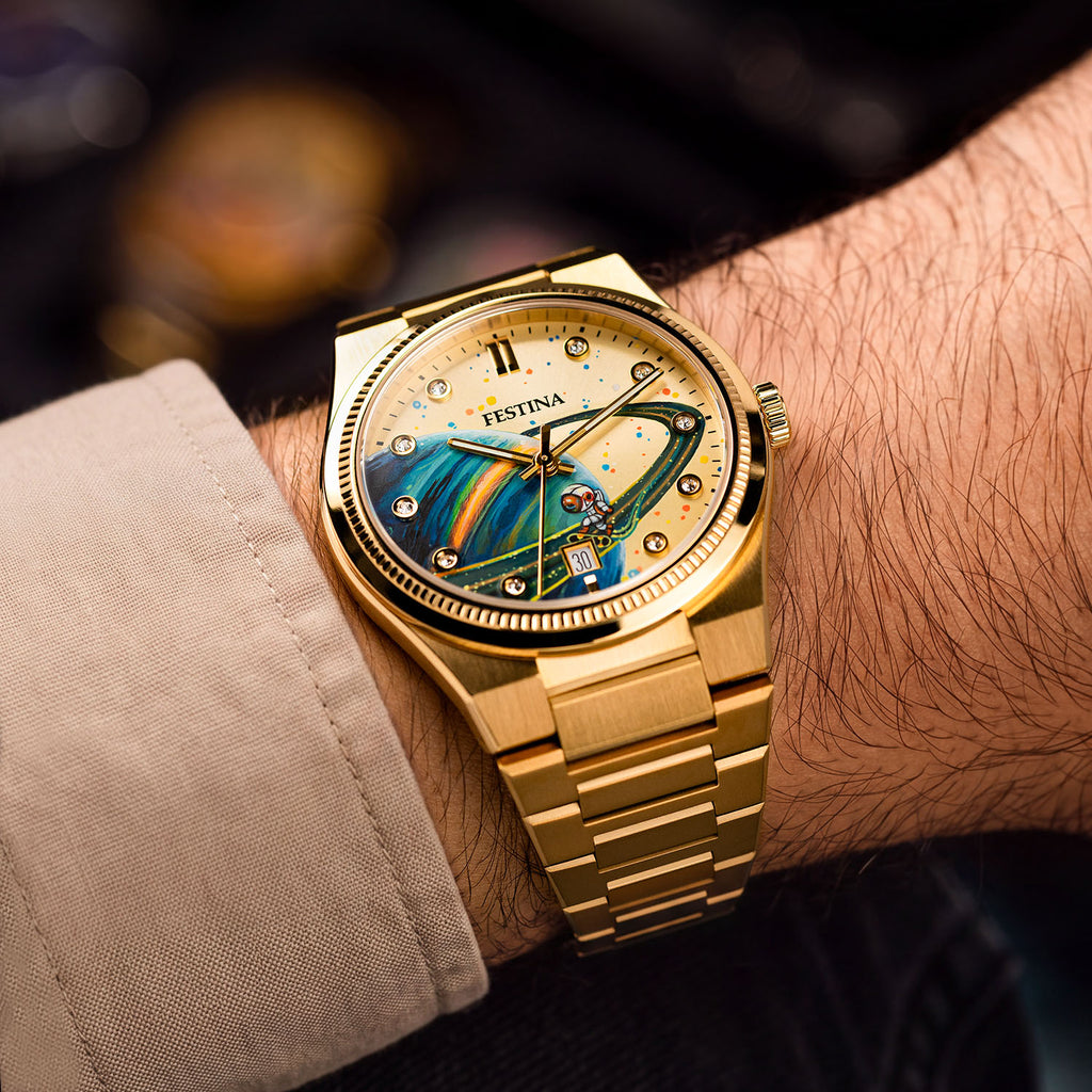 Festina Rive Space Ollie — Gold-tone case and integrated bracelet on the wrist, angled to show a hand-painted planet sweeping across the custom dial, a bespoke timepiece by IFL Watches.