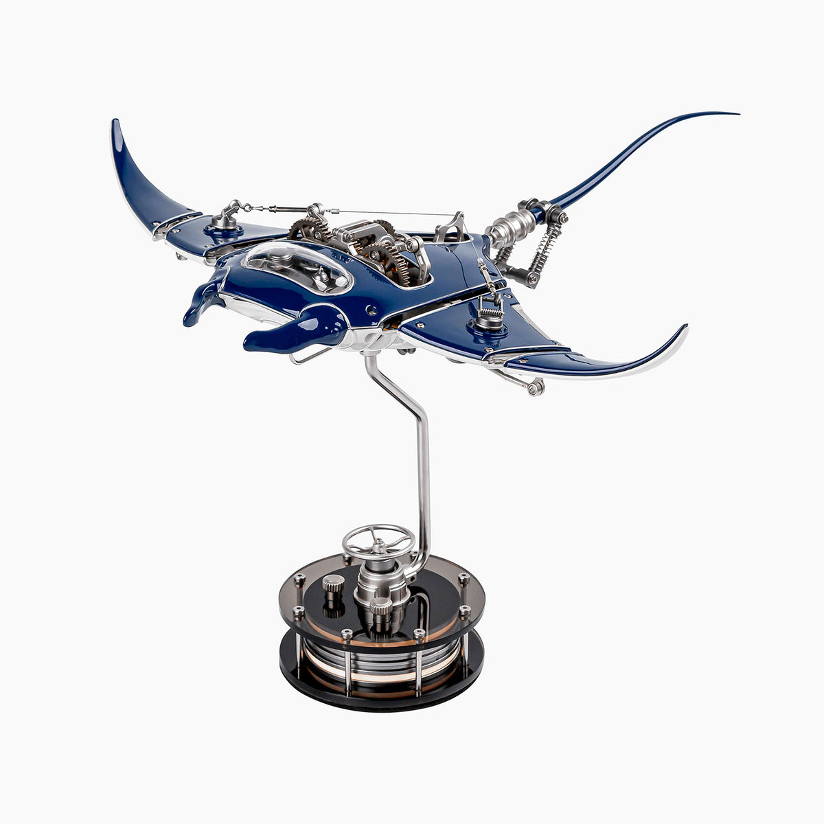 Mecha Ray Blue — the manta with wings raised mid-stroke, a chromed support arm rising from its weighted base, mechanical sculpture by IFL Watches.