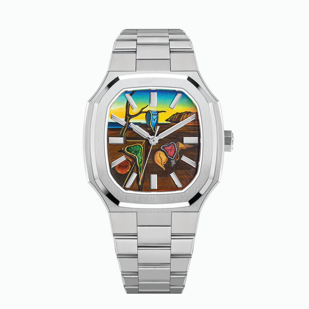 MAEN Manhattan Memento — Hand-painted custom dial with soft watches draped over a bare branch and a stone plinth, a closed watch marked IFLW and golden cliffs under a blue-to-yellow sky, set in a 37mm octagonal stainless steel case on an integrated bracelet, a bespoke timepiece by IFL Watches.