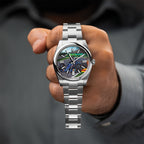Apex Concept — Custom hand-painted racing dial held in the hand, blue machine cornering across gray asphalt, a bespoke timepiece by IFL Watches.