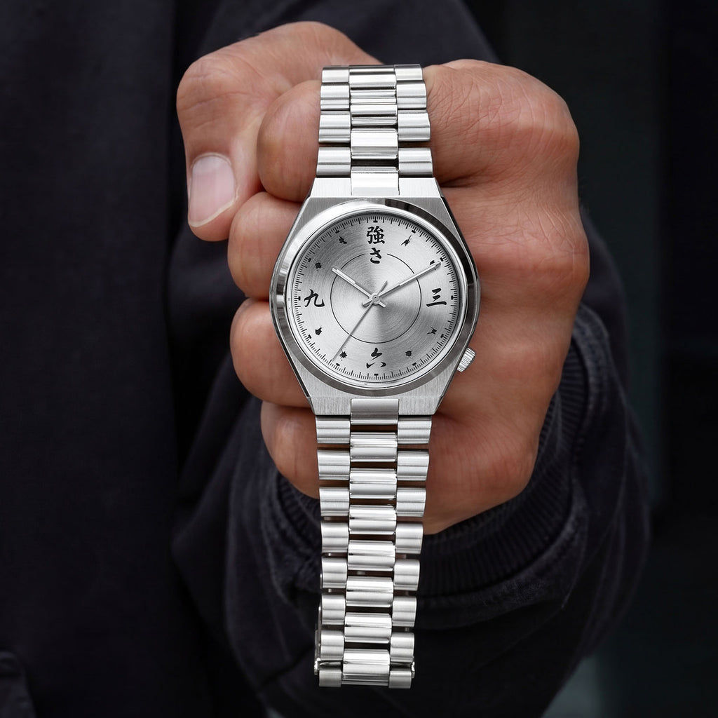 Citizen Tsuyosa Kanji held in hand — front-facing view showing the calligraphy-style indices at 12, 3, 6, and 9 with concentric finishing on the dial and stainless steel bracelet, a custom timepiece by IFL Watches.