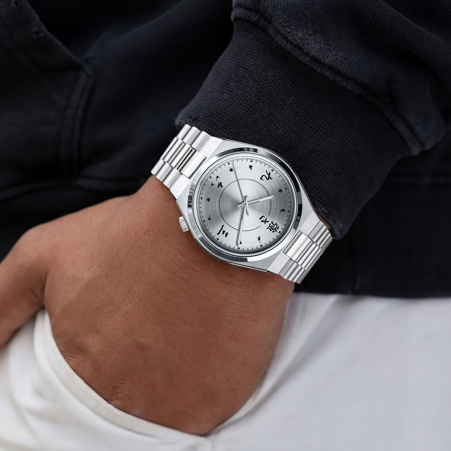 Citizen Tsuyosa Kanji on wrist — the silver sunburst dial with Japanese numerals at every hour, worn casually with a dark jacket and light trousers, a custom timepiece by IFL Watches.
