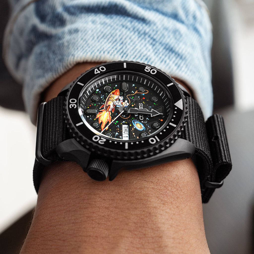 Space Cowboy Concept – Hand-painted custom Seiko 5 Sports featuring cosmic cowboy riding rocket through space, bespoke timepiece by IFL Watches