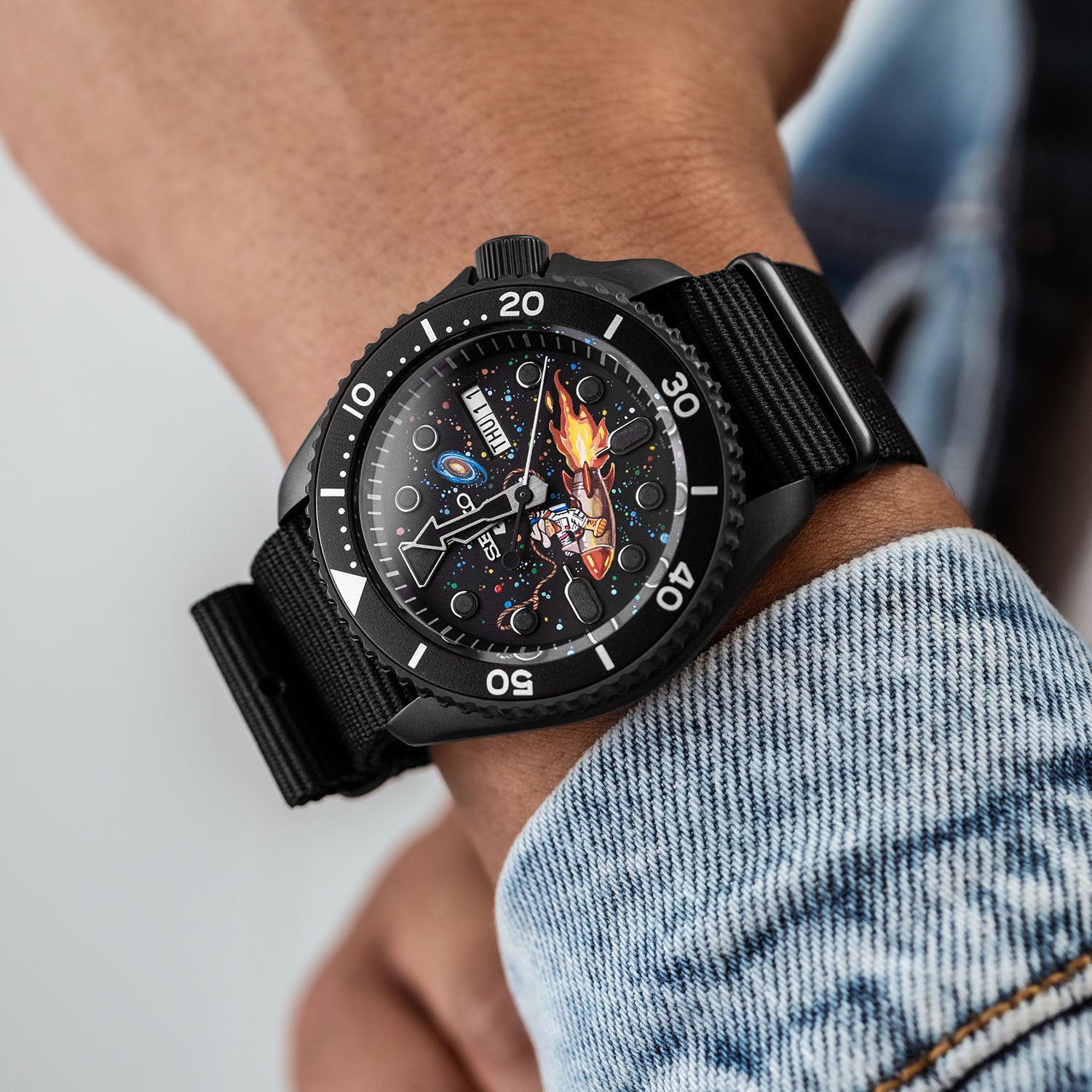 Space Cowboy Concept – Hand-painted custom Seiko 5 Sports featuring cosmic cowboy riding rocket through space, bespoke timepiece by IFL Watches