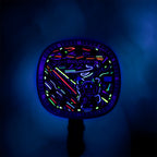 Bulova Super Seville Scream — The dial under UV light, its neon strokes glowing pink, green, cyan and violet around the figure's outline, customized limited edition by IFL Watches