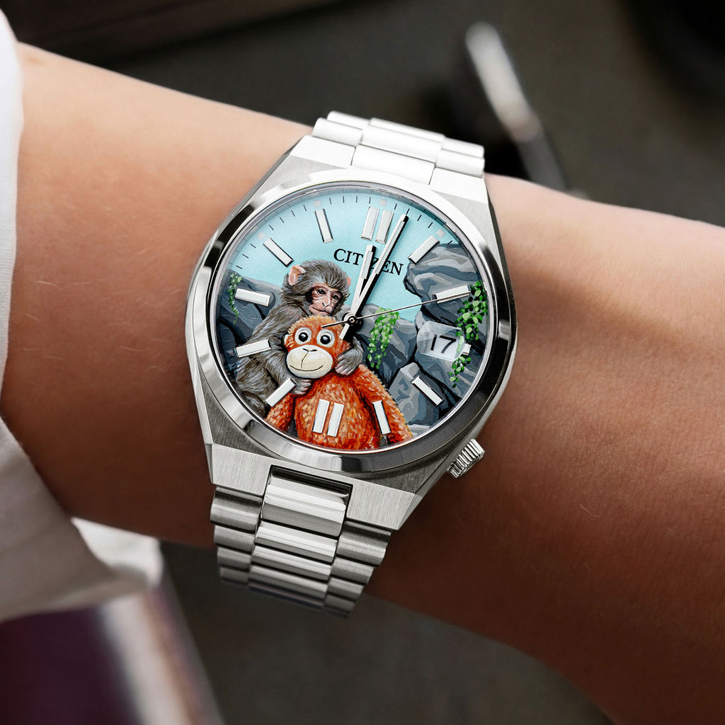 Citizen Tsuyosa Punch — Hand-painted custom Citizen Tsuyosa Automatic featuring a baby snow monkey holding his orange stuffed orangutan plushie inspired by the true story of Punch from Ichikawa City Zoo, a bespoke timepiece by IFL Watches