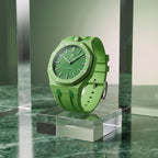 Green Eight Swatch × AP Royal Pop Rubber Case-Strap — rich green kit with the Royal Pop seated in the case, studio still life on a glass block, by IFL Watches
