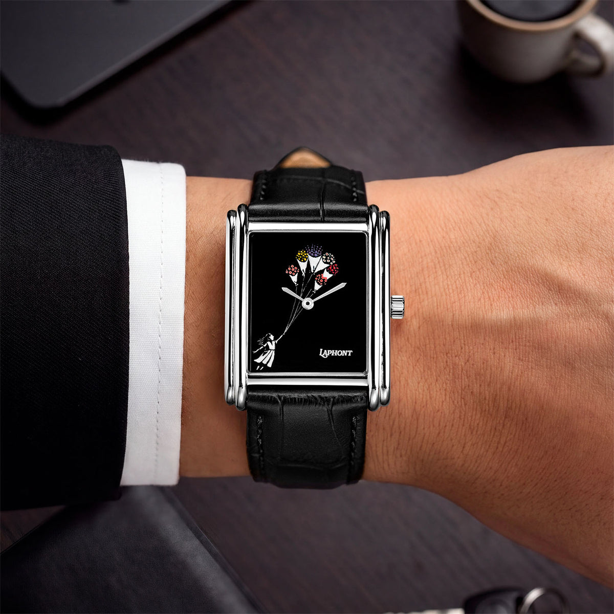 Laphont Bloc Bouquella — Seen from above on the wrist, a white shirt cuff and dark sleeve framing the black croc-embossed strap and stepped steel case, a custom limited edition watch by IFL Watches