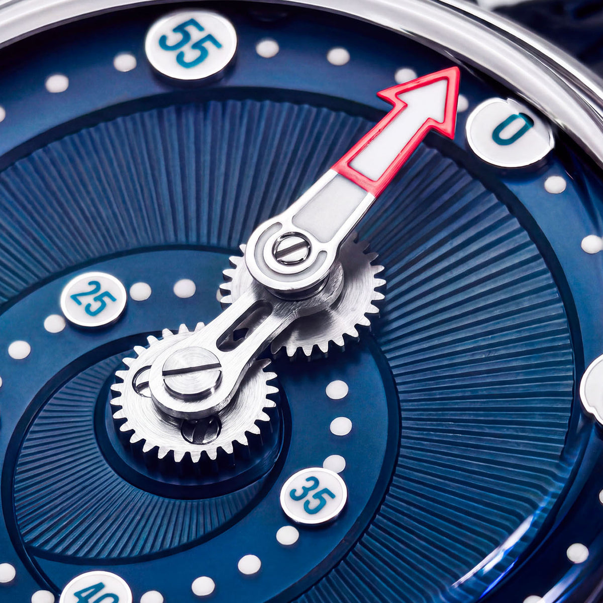 Mandetbrote Orbital Blue Kiss — Macro detail of the geared minute arm over the radiating blue dial texture, available at IFL Watches.