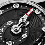 Mandetbrote Orbital Midnight Black — Macro detail of the geared minute arm and red-tipped hand over the radiating dial texture, available at IFL Watches.