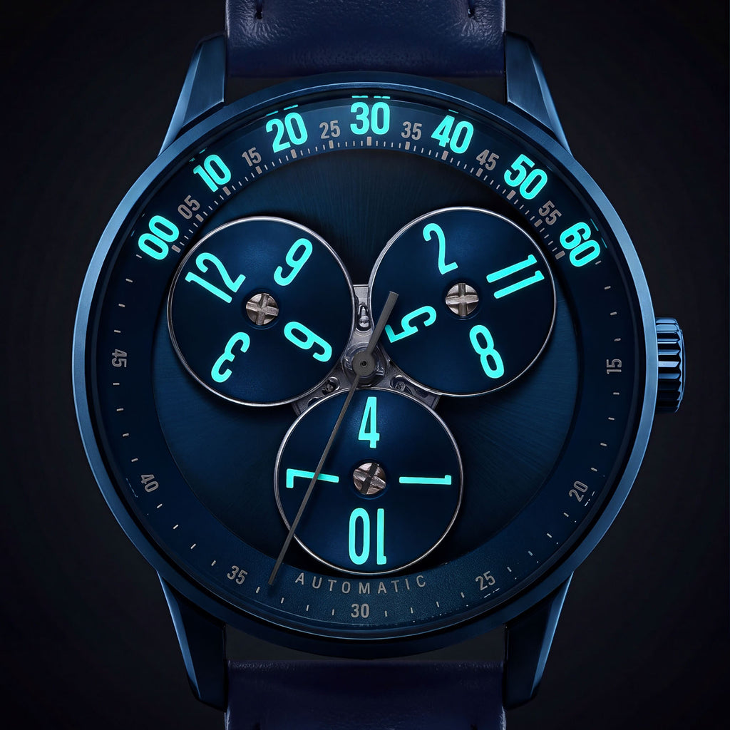 Mandetbrote Wandering Hour Dark Blue — In the dark, with the hour numerals and minute track glowing, available at IFL Watches.