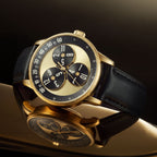 Mandetbrote Wandering Hour Gold — Angled on a reflective surface, showing the case and crown, available at IFL Watches.