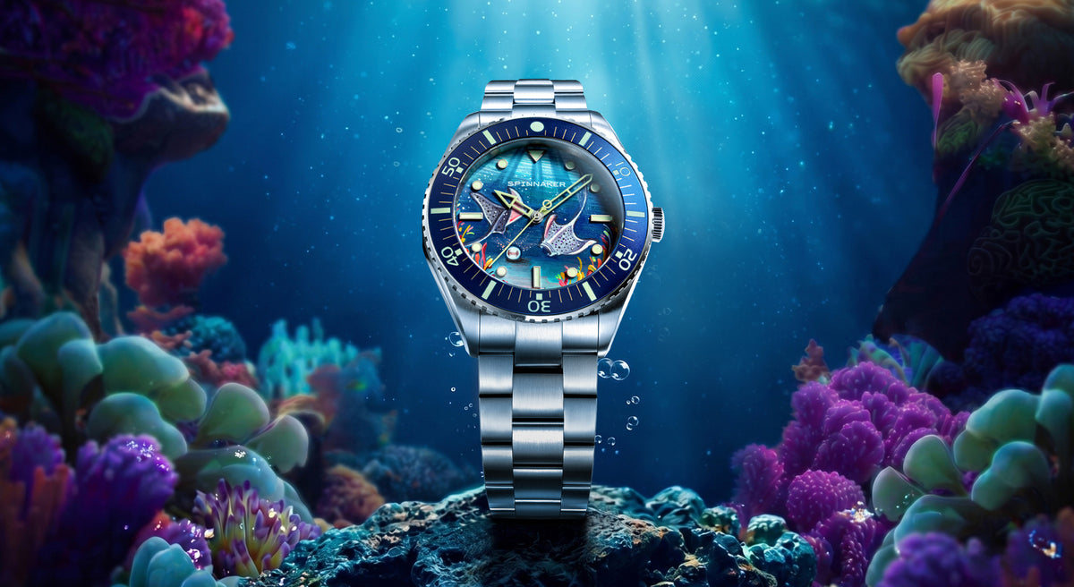 Spinnaker Spence Underwater Dancers Limited Edition — Desktop banner with the watch resting among sea anemone tentacles in sunlit water.