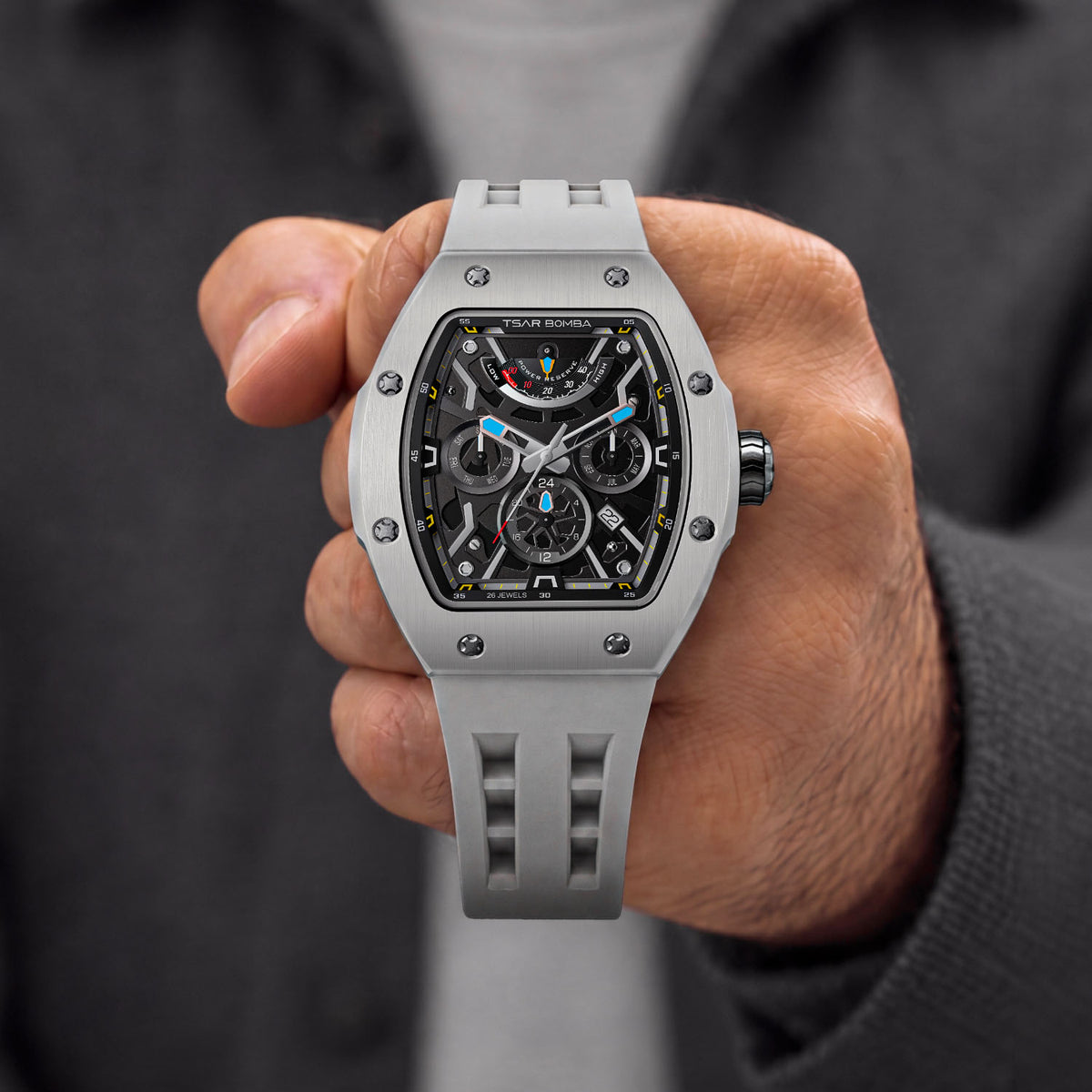Tsar Bomba Atomic Ghost Grey — Held in hand, showing the open-worked dial and screwed bezel, available at IFL Watches.