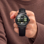 Vortichron Double Roller Midnight Black — Held in hand against a brown knit sweater, showing the two numbered rollers, available at IFL Watches.
