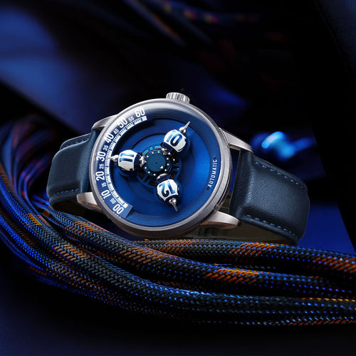 Vortichron Timeorb Blue — Three-quarter view resting on braided cord in deep blue light, available at IFL Watches.