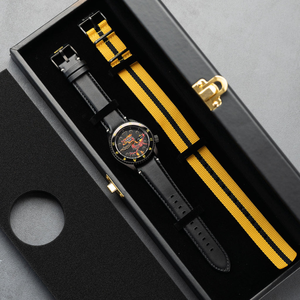 Custom Seiko 5 Sports 55th Anniversary Bruce Lee Limited Edition watch featuring hand-painted dragon design by IFL Watches, bespoke timepiece with black leather and yellow nylon straps.